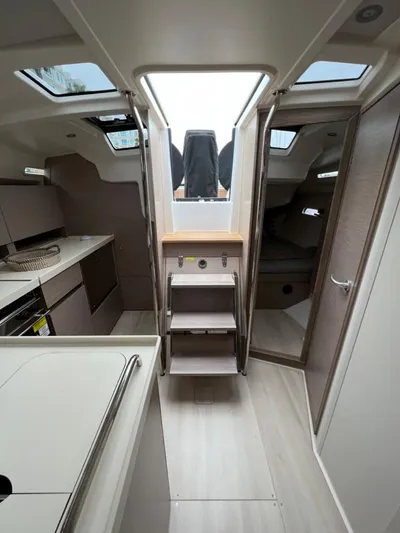 Mdr 388 #305 In Stock Yacht Photos Pics Interior of 2023 Hanse 388 sailboat with modern kitchen and cozy cabin.