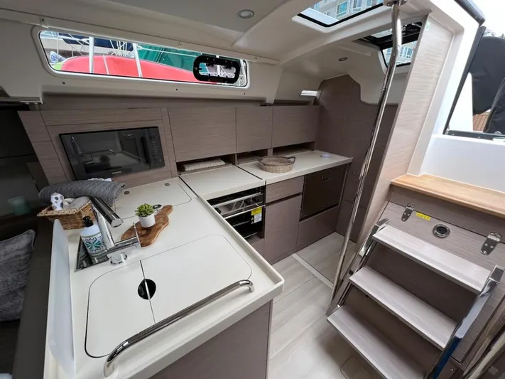 Mdr 388 #305 In Stock Yacht Photos Pics Modern kitchen area in 2023 Hanse 388 yacht with sleek cabinetry and appliances.