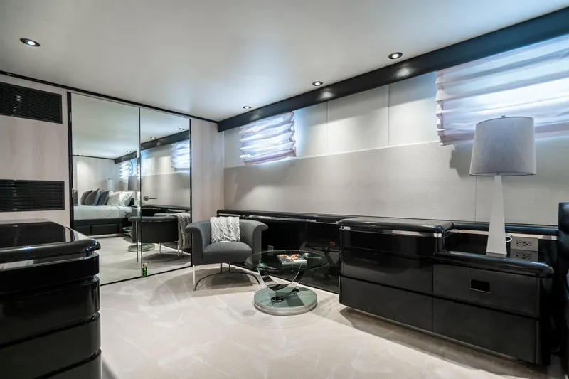 Quantum Yacht Photos Pics Luxurious interior of a 1989 Broward Tri-Deck yacht with modern furnishings.