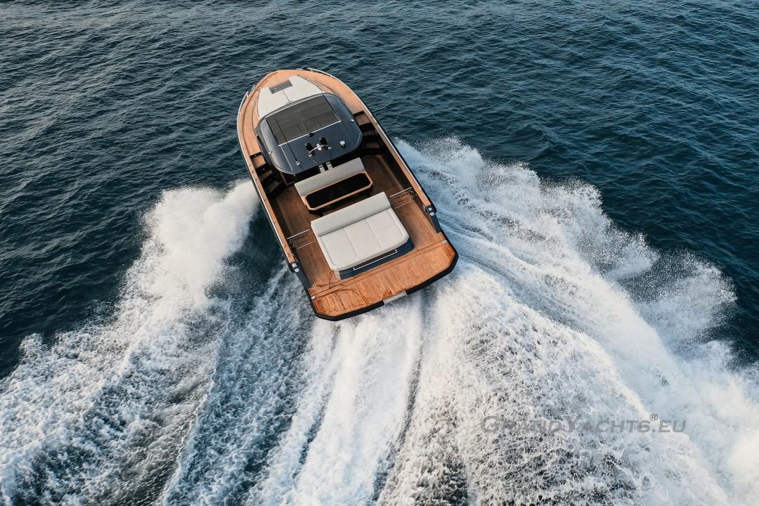 2025 Focus Forza 37 yacht cruising on open water, aerial view.