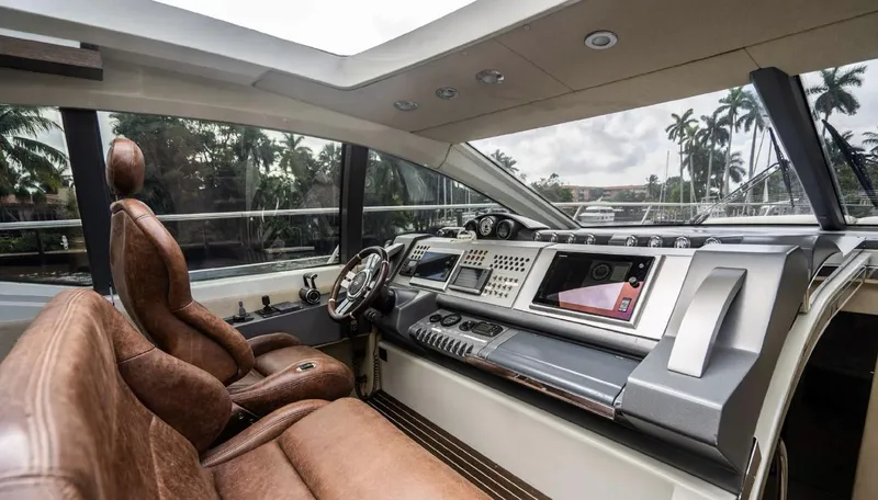 Lunsea Yacht Photos Pics Luxurious interior of 2005 Azimut 68S yacht with leather seating and modern dashboard.