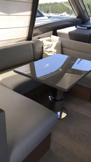  Yacht Photos Pics Luxurious interior of 2020 Ferretti Yachts 450 with sleek seating and modern table design.