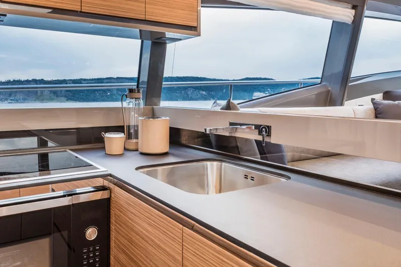  Yacht Photos Pics Modern kitchen interior on 2020 Ferretti Yachts 450, featuring sleek design and ocean view.