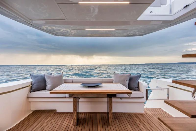  Yacht Photos Pics Luxurious Ferretti Yachts 450, 2020 model, with elegant deck seating and ocean view.