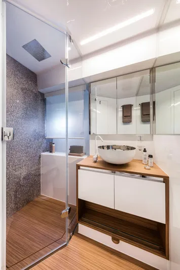  Yacht Photos Pics Modern bathroom in 2020 Ferretti Yachts 450, featuring glass shower and stylish sink.