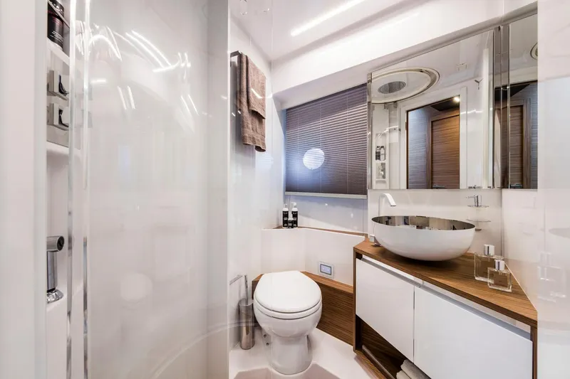  Yacht Photos Pics Luxurious bathroom in 2020 Ferretti Yachts 450, featuring modern fixtures and elegant design.