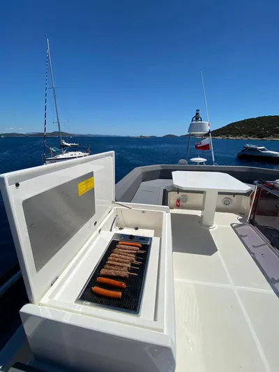  Yacht Photos Pics Ferretti Yachts 450, 2020 model, with onboard grill, cruising on a sunny day.