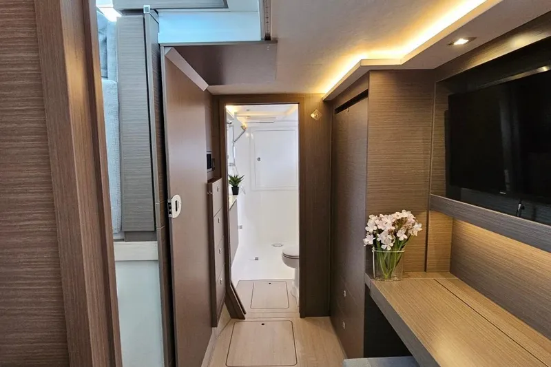  Yacht Photos Pics Luxurious interior of 2023 Leopard 40 Powercat yacht with modern wood finish and elegant lighting.