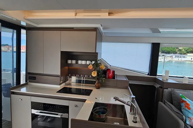  Yacht Photos Pics Modern kitchen interior on 2023 Leopard 40 Powercat yacht, featuring sleek design and waterfront view.