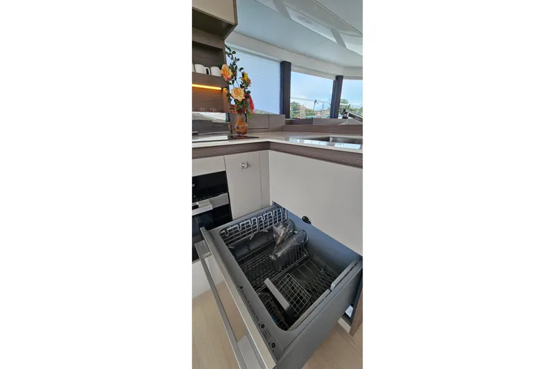  Yacht Photos Pics Modern kitchen on 2023 Leopard 40 Powercat with open dishwasher and floral decor.