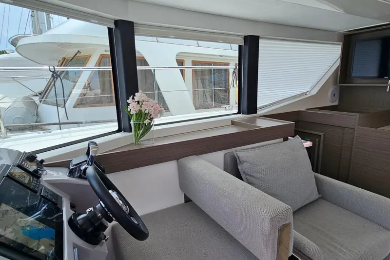  Yacht Photos Pics Interior of 2023 Leopard 40 Powercat with modern helm and cozy seating area.