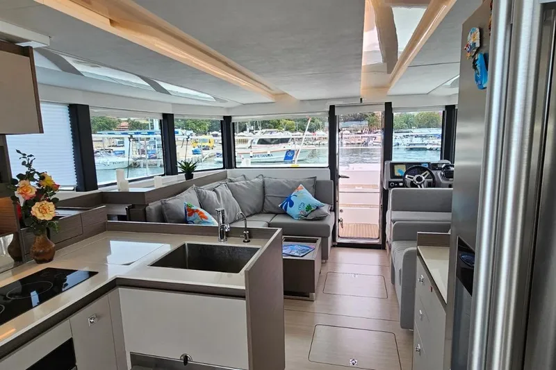  Yacht Photos Pics Interior of 2023 Leopard 40 Powercat yacht with modern kitchen and spacious seating area.