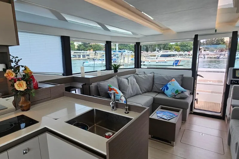  Yacht Photos Pics Luxurious interior of 2023 Leopard 40 Powercat yacht with modern kitchen and cozy seating area.