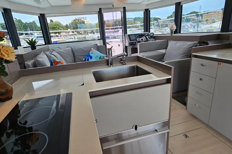  Yacht Photos Pics Modern interior of 2023 Leopard 40 Powercat yacht with kitchen and seating area.