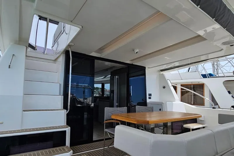  Yacht Photos Pics 2023 Leopard 40 Powercat yacht interior with modern seating and dining area.