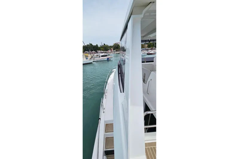  Yacht Photos Pics 2023 Leopard 40 Powercat docked, showcasing sleek design and spacious deck.