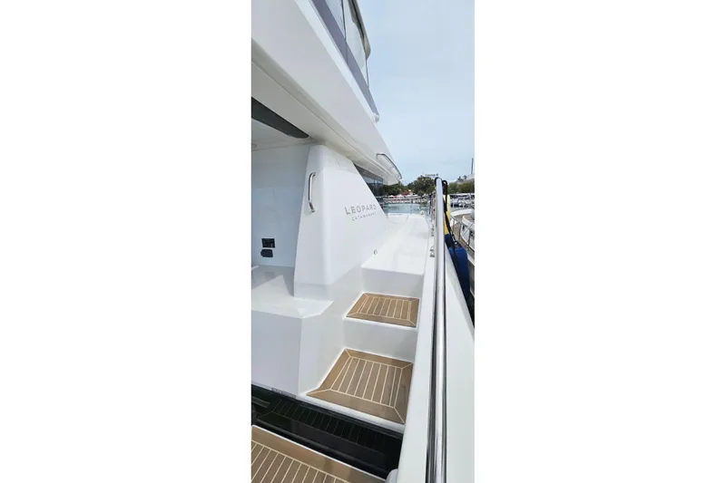  Yacht Photos Pics 2023 Leopard 40 Powercat yacht, side view with steps and railing.