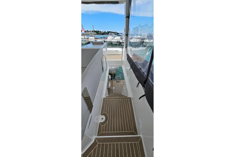  Yacht Photos Pics 2023 Leopard 40 Powercat yacht deck with marina view.