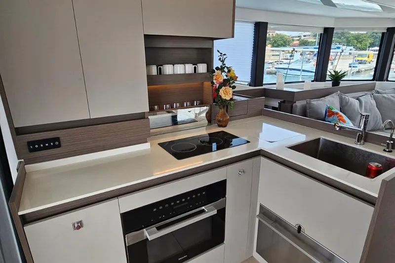  Yacht Photos Pics Modern kitchen interior of 2023 Leopard 40 Powercat yacht, featuring sleek design and appliances.