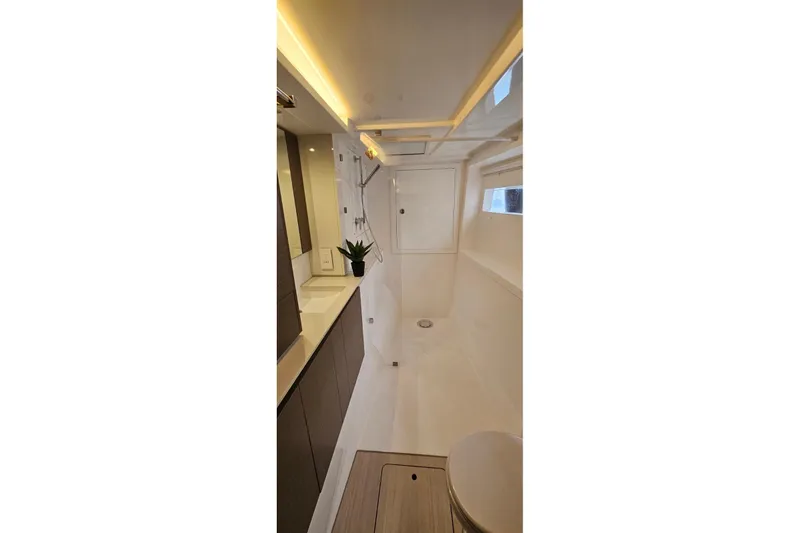  Yacht Photos Pics Modern bathroom interior of 2023 Leopard 40 Powercat yacht, featuring sleek design and lighting.