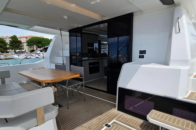  Yacht Photos Pics 2023 Leopard 40 Powercat yacht interior with dining area and modern design.