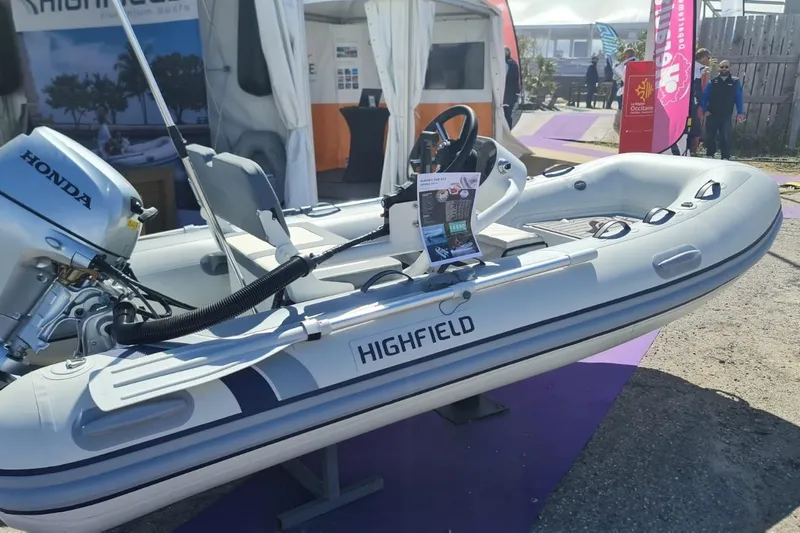  Yacht Photos Pics Highfield inflatable boat with Honda engine on display at a boat show, 2023 Leopard 40 Powercat.