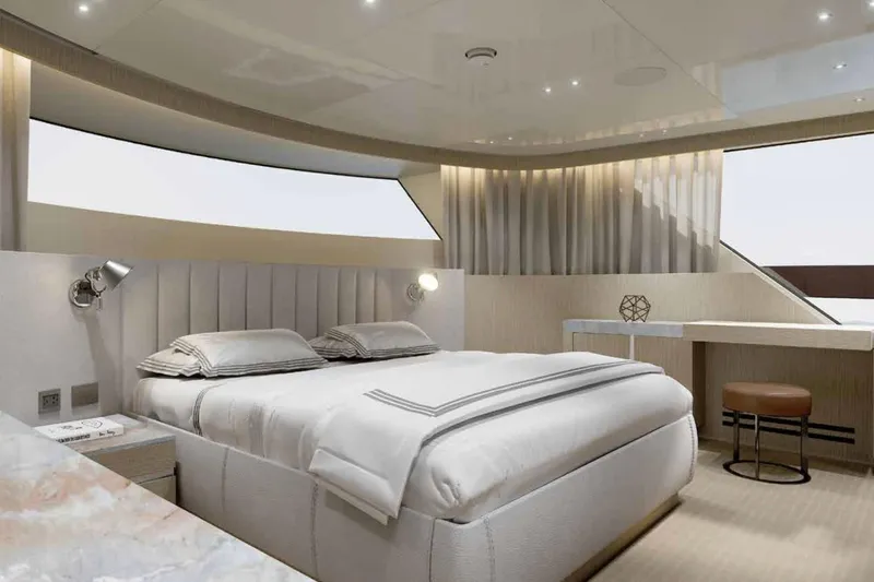  Yacht Photos Pics Luxurious bedroom interior of 2026 Sanlorenzo SX100 yacht with modern design and elegant furnishings.