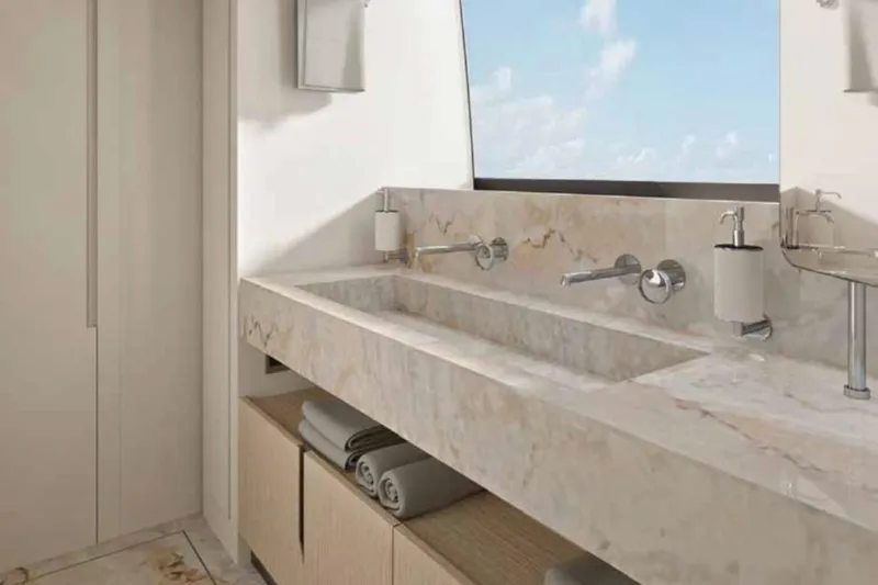  Yacht Photos Pics Luxurious bathroom interior of 2026 Sanlorenzo SX100 yacht with marble sink and ocean view.