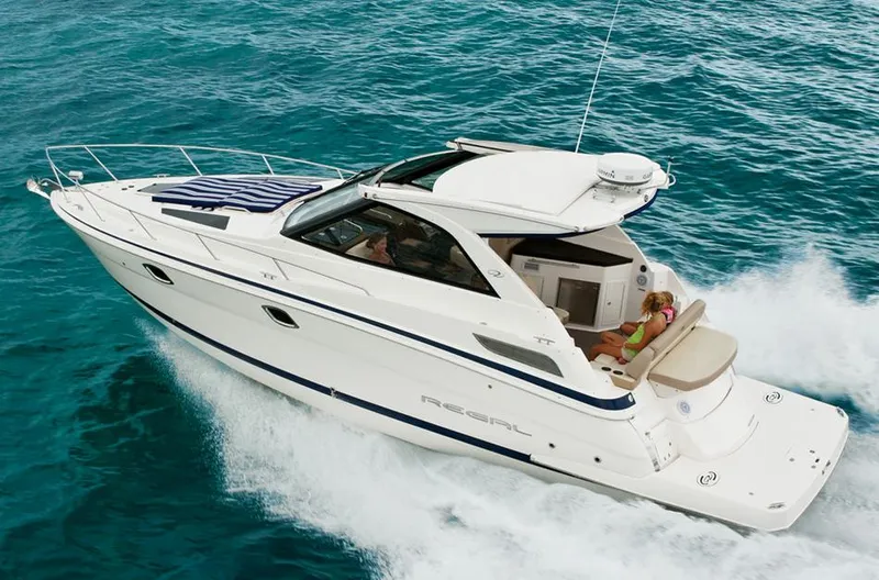Sound Decision Yacht Photos Pics Manufacturer Provided Image: 2013 Regal 35 Sport Coupe cruising on clear blue water.