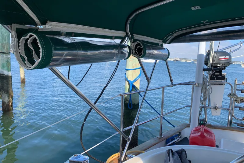 Elation Yacht Photos Pics Cabo Rico 42 Pilot 2004 with full cockpit enclosure and Suzuki outboard