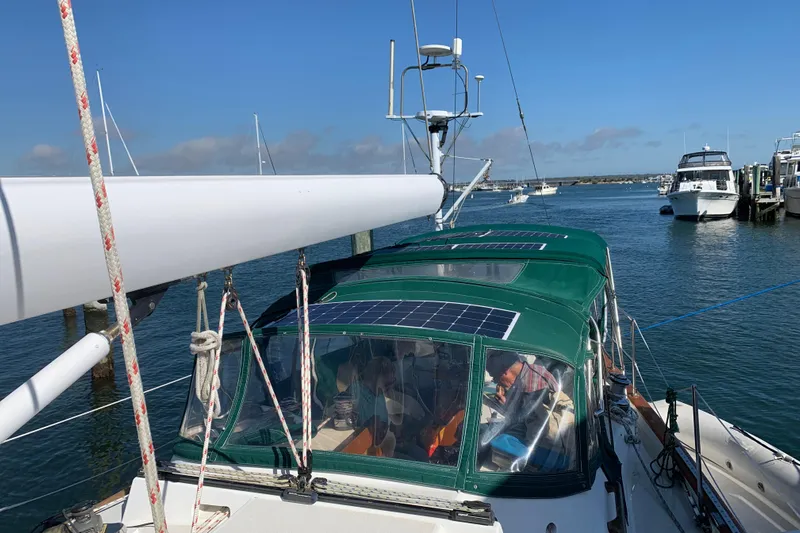 Elation Yacht Photos Pics 2004 Cabo Rico 42 Pilot sailboat with solar panels docked in a marina.