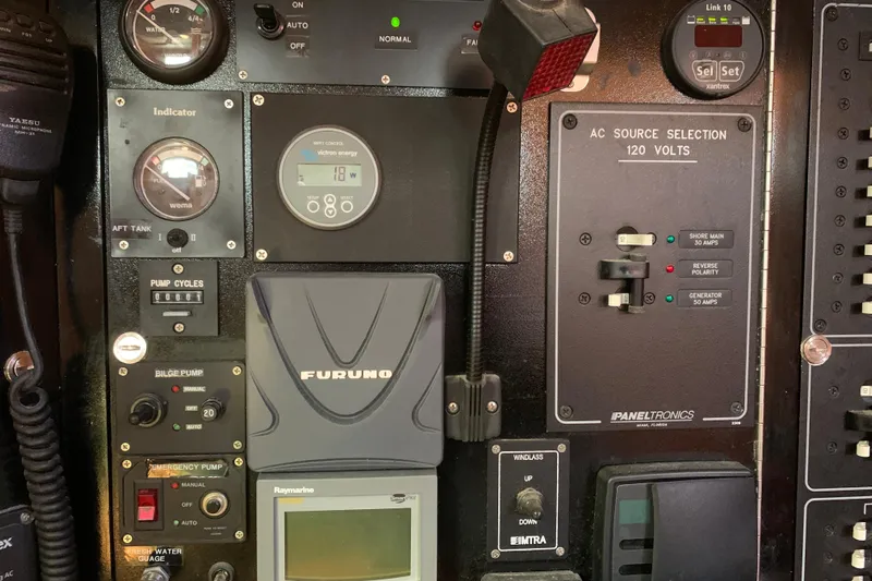 Elation Yacht Photos Pics Control panel of a 2004 Cabo Rico 42 Pilot yacht with various gauges and switches.