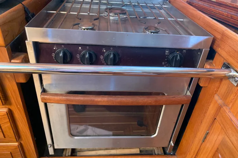 Elation Yacht Photos Pics Stainless steel stove and oven in 2004 Cabo Rico 42 Pilot yacht kitchen.