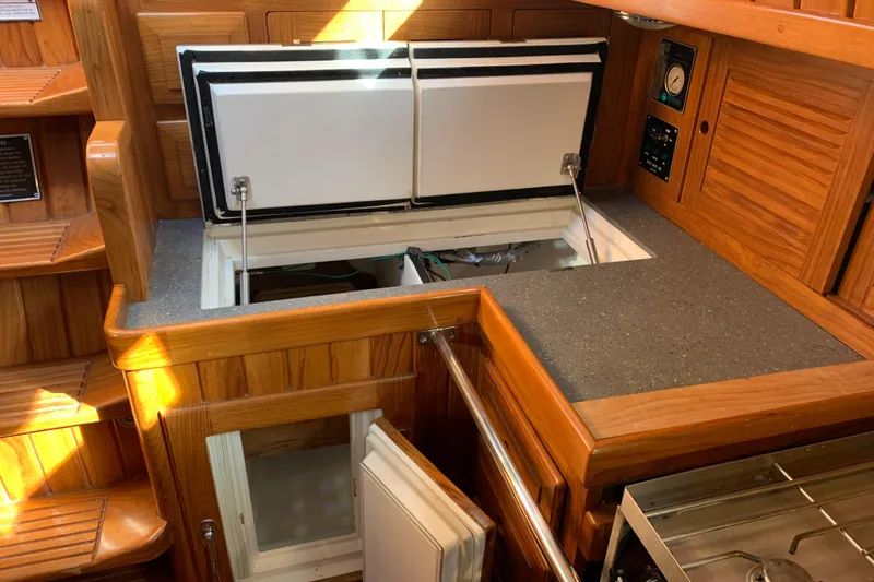 Elation Yacht Photos Pics Interior of 2004 Cabo Rico 42 Pilot yacht with open storage compartments.