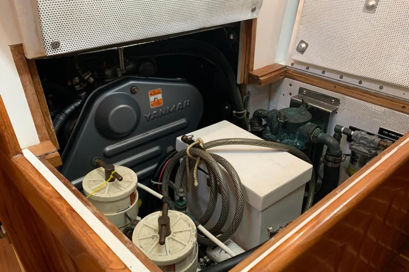 Elation Yacht Photos Pics Engine compartment of 2004 Cabo Rico 42 Pilot with Yanmar engine components.