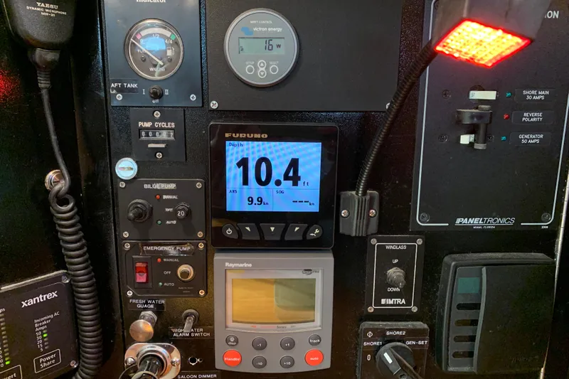 Elation Yacht Photos Pics Control panel of a 2004 Cabo Rico 42 Pilot yacht with various gauges and switches.