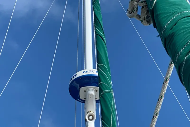 Elation Yacht Photos Pics Mast and rigging of 2004 Cabo Rico 42 Pilot sailboat against blue sky.