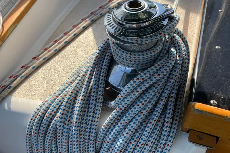 Elation Yacht Photos Pics Winch with coiled rope on 2004 Cabo Rico 42 Pilot sailboat deck.