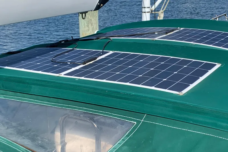 Elation Yacht Photos Pics Solar panels on 2004 Cabo Rico 42 Pilot sailboat, docked by the water.