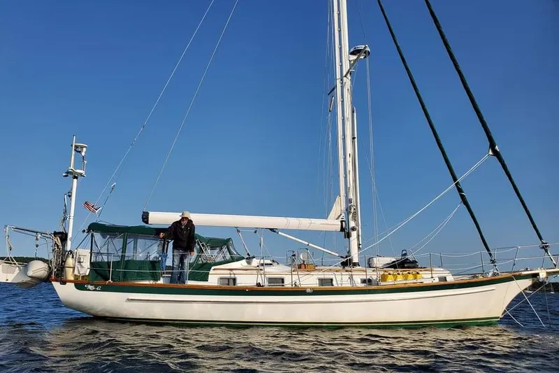 Elation Yacht Photos Pics Sailing yacht Cabo Rico 42, 2005 model, on open water with clear blue sky.