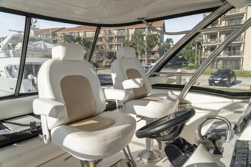  Yacht Photos Pics Interior of 2008 Sea Ray 58 Sedan Bridge yacht with luxurious captain chairs.