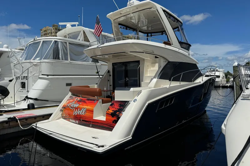  Yacht Photos Pics 2017 Carver C40 Command Bridge yacht docked at marina under clear blue sky.