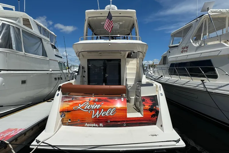  Yacht Photos Pics 2017 Carver C40 Command Bridge yacht docked, featuring "Livin' Well" signage, Apopka, FL.