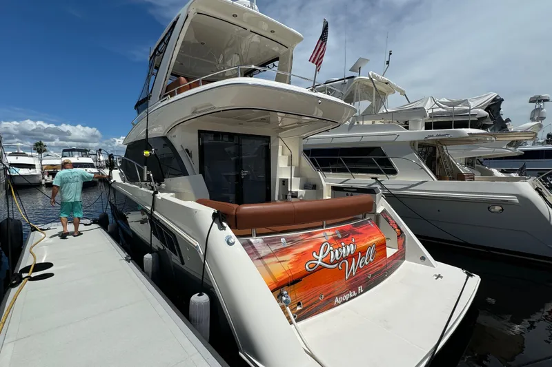  Yacht Photos Pics 2017 Carver C40 Command Bridge yacht docked, featuring "Livin' Well" signage, Apopka, FL.