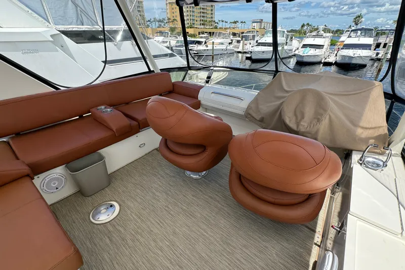  Yacht Photos Pics Luxurious 2017 Carver C40 Command Bridge yacht interior with brown leather seating at marina.