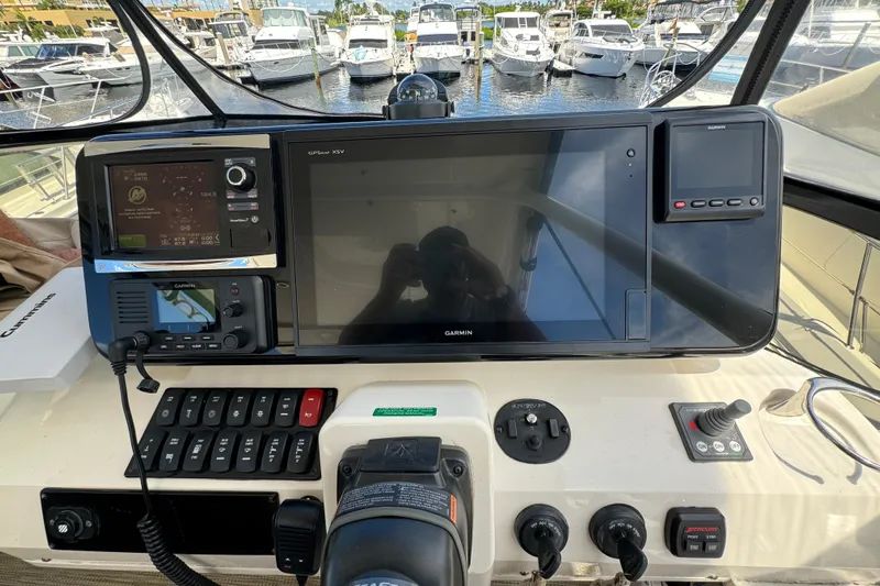  Yacht Photos Pics 2017 Carver C40 Command Bridge helm with Garmin navigation system, docked at marina.
