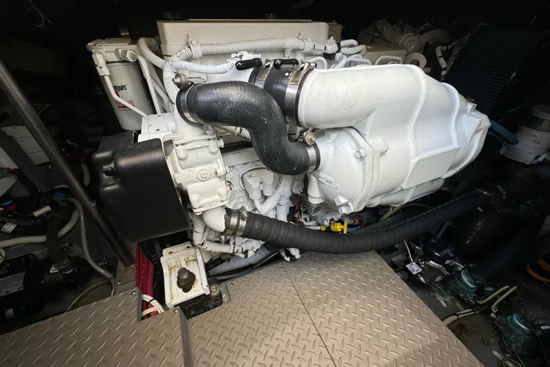  Yacht Photos Pics Engine room of a 2017 Carver C40 Command Bridge, showcasing mechanical components.