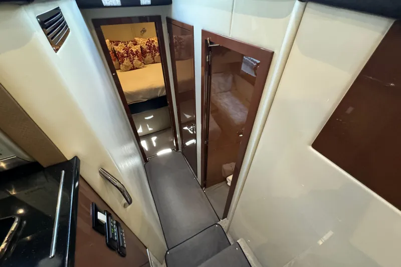  Yacht Photos Pics Interior view of 2017 Carver C40 Command Bridge yacht, featuring a cozy cabin hallway.