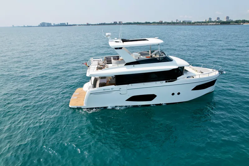 Just You Yacht Photos Pics Luxury 2023 Absolute 52 Navetta yacht cruising on open water.