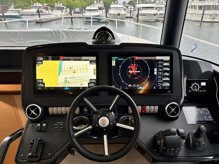 Just You Yacht Photos Pics Cockpit of 2023 Absolute 52 Navetta yacht with advanced navigation displays.